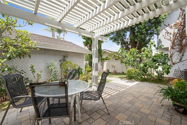 43 W Yale Loop Unit 29, Irvine, CA 92604 - view of patio with outdoor dining space and a pergola