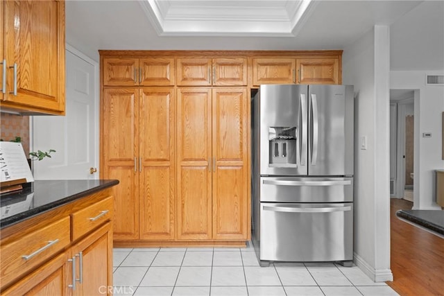 43 W Yale Loop Unit 29, Irvine, CA 92604 - kitchen featuring stainless steel fridge, a tray ceiling, brown cabinetry, crown molding, and light tile patterned floors