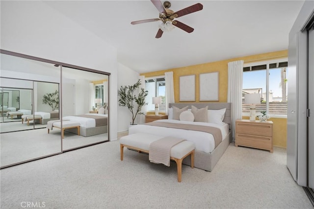 43 W Yale Loop Unit 29, Irvine, CA 92604 - bedroom featuring multiple windows, carpet flooring, high vaulted ceiling, a closet, and ceiling fan