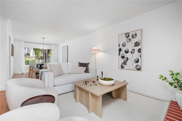 43 W Yale Loop Unit 29, Irvine, CA 92604 - living room with ornamental molding, a chandelier, and wood finished floors
