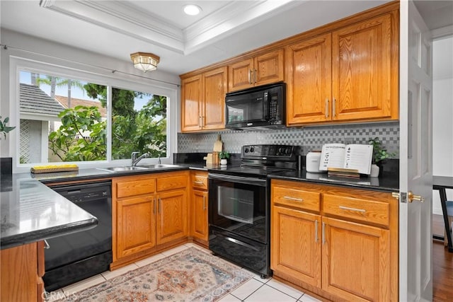 43 W Yale Loop Unit 29, Irvine, CA 92604 - kitchen with black appliances, ornamental molding, decorative backsplash, brown cabinetry, and recessed lighting