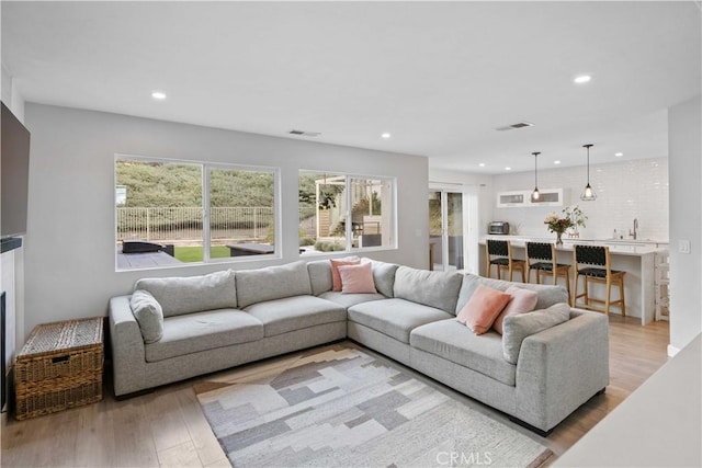17913 Maplehurst Pl, Canyon Country, CA 91387 - living area featuring recessed lighting, healthy amount of natural light, and light wood finished floors