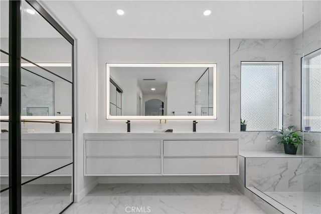 17913 Maplehurst Pl, Canyon Country, CA 91387 - bathroom with marble look tile flooring, double vanity, recessed lighting, and a marble finish shower