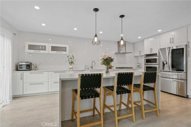 17913 Maplehurst Pl, Canyon Country, CA 91387 - kitchen featuring appliances with stainless steel finishes, a sink, light countertops, white cabinetry, and recessed lighting
