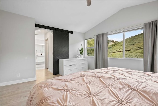 17913 Maplehurst Pl, Canyon Country, CA 91387 - bedroom with vaulted ceiling, light wood-style floors, baseboards, a ceiling fan, and arched walkways