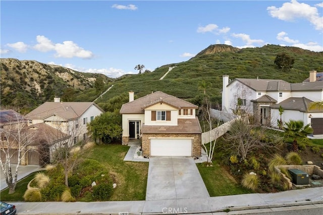 17913 Maplehurst Pl, Canyon Country, CA 91387 - view of front of house featuring stone siding, a mountain view, concrete driveway, and a tiled roof