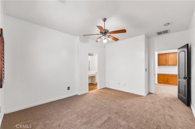2904 Granite Ridge Pl, Bakersfield, CA 93313 - unfurnished bedroom featuring light carpet, baseboards, ensuite bathroom, and ceiling fan