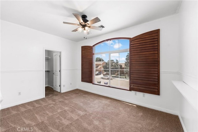 2904 Granite Ridge Pl, Bakersfield, CA 93313 - unfurnished bedroom featuring carpet flooring, a spacious closet, baseboards, and ceiling fan