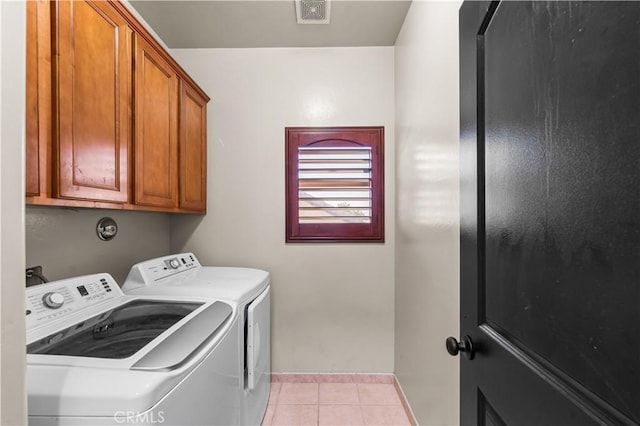 2904 Granite Ridge Pl, Bakersfield, CA 93313 - laundry area with washer and dryer, light tile patterned floors, cabinet space, and baseboards