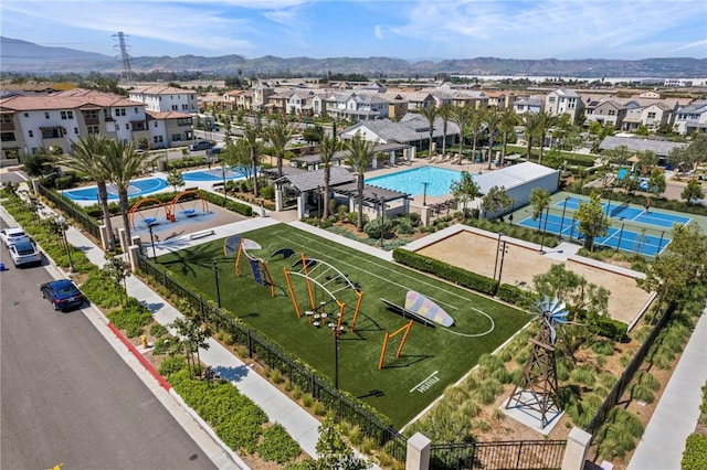 16145 Sandpiper Ave, Chino, CA 91708 - aerial view of residential area featuring a mountain backdrop and a pool