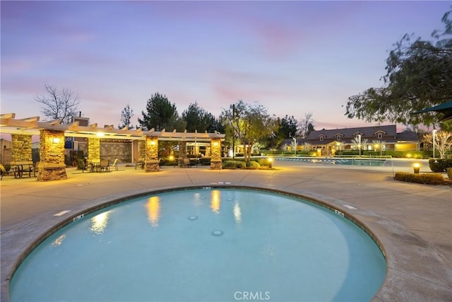 3883 Taconite Rd, San Bernardino, CA 92407 - pool at dusk with an outdoor pool and a patio