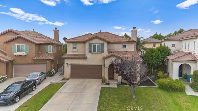 3883 Taconite Rd, San Bernardino, CA 92407 - mediterranean / spanish home with a garage, concrete driveway, stucco siding, and a front lawn