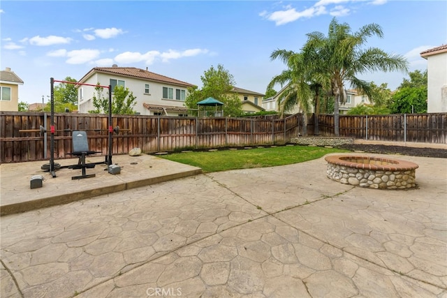 3883 Taconite Rd, San Bernardino, CA 92407 - fenced backyard featuring an outdoor fire pit, a patio area, and a residential view