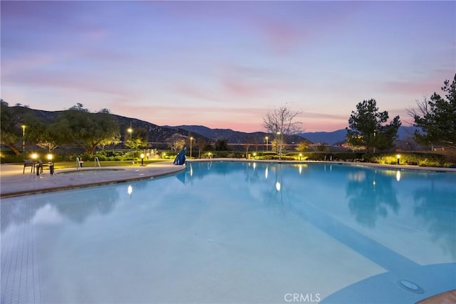 3883 Taconite Rd, San Bernardino, CA 92407 - pool at dusk featuring an infinity pool and a mountain view
