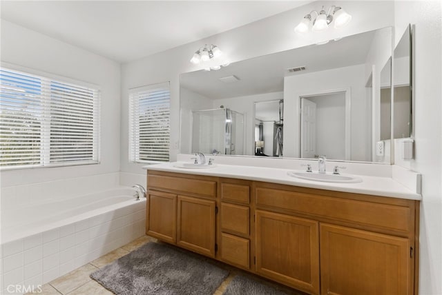 3883 Taconite Rd, San Bernardino, CA 92407 - bathroom featuring double vanity, a stall shower, a bath, and tile patterned floors
