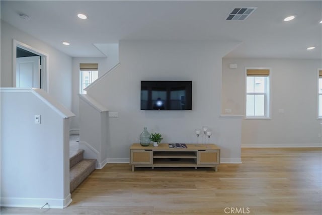 21 Welltree Way, Rancho Mission Viejo, CA 92694 - living room with light wood-type flooring, recessed lighting, baseboards, and stairs