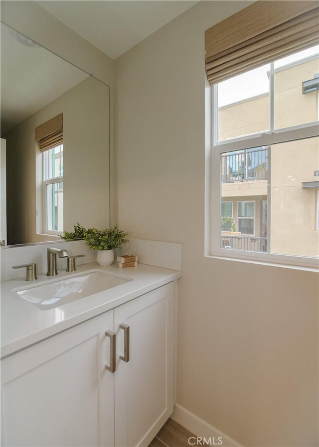 21 Welltree Way, Rancho Mission Viejo, CA 92694 - bathroom featuring vanity, baseboards, and wood finished floors