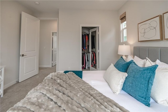 21 Welltree Way, Rancho Mission Viejo, CA 92694 - bedroom with a walk in closet, carpet flooring, a closet, and baseboards