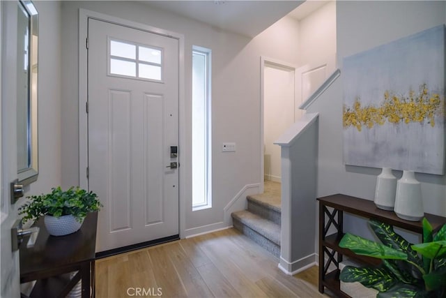 21 Welltree Way, Rancho Mission Viejo, CA 92694 - entrance foyer with wood finished floors, stairway, and baseboards