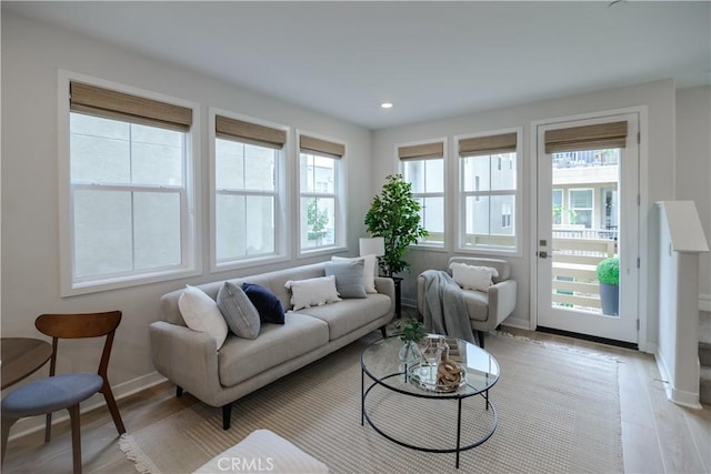 21 Welltree Way, Rancho Mission Viejo, CA 92694 - living area featuring light wood finished floors, baseboards, and recessed lighting