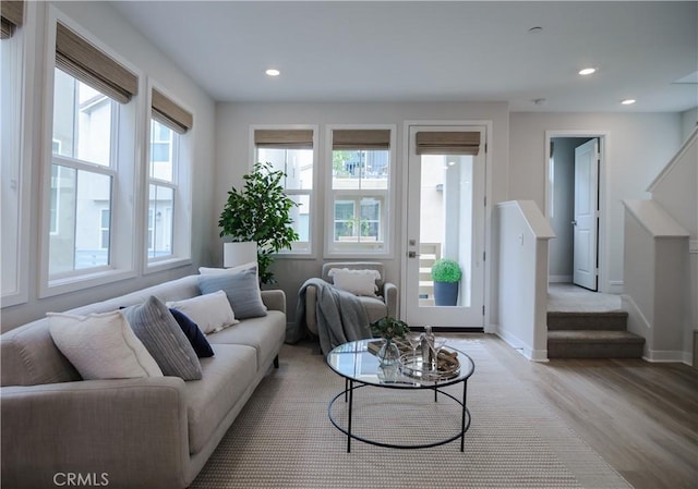 21 Welltree Way, Rancho Mission Viejo, CA 92694 - living area featuring light wood finished floors, healthy amount of natural light, recessed lighting, baseboards, and stairs