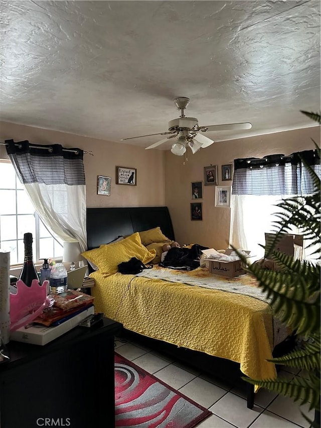 2607 E 135th St, Compton, CA 90222 - bedroom with tile patterned flooring, multiple windows, and ceiling fan