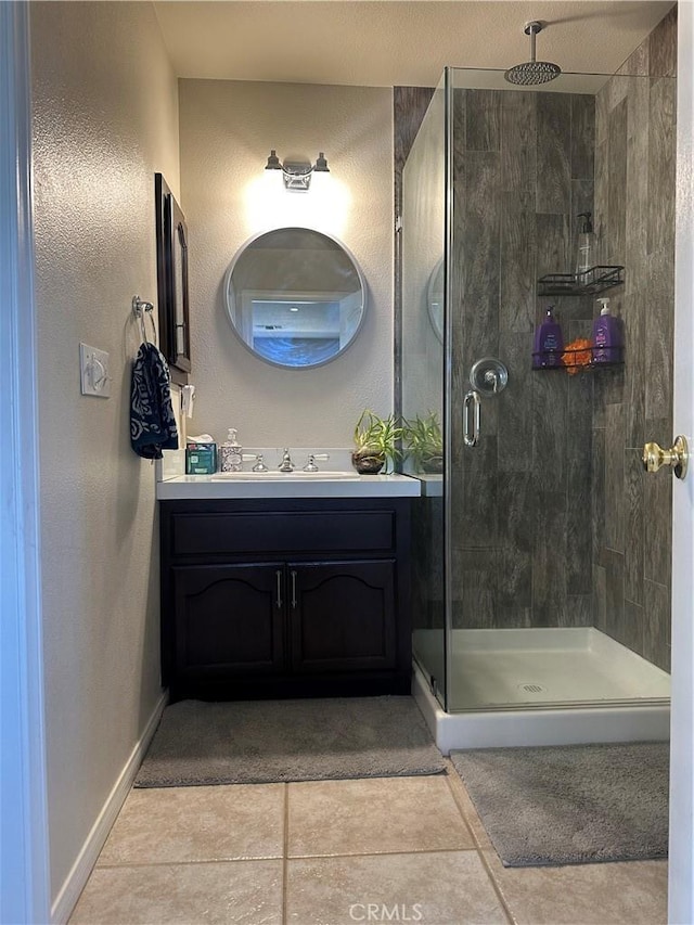 8843 San Diego Dr, Yucca Valley, CA 92284 - bathroom with a shower stall, vanity, baseboards, and tile patterned flooring
