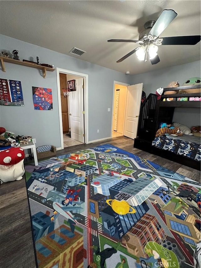 8843 San Diego Dr, Yucca Valley, CA 92284 - bedroom featuring baseboards, a ceiling fan, and wood finished floors