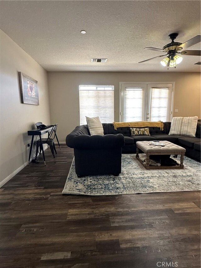 8843 San Diego Dr, Yucca Valley, CA 92284 - living room featuring a textured ceiling, a ceiling fan, dark wood-style flooring, and baseboards
