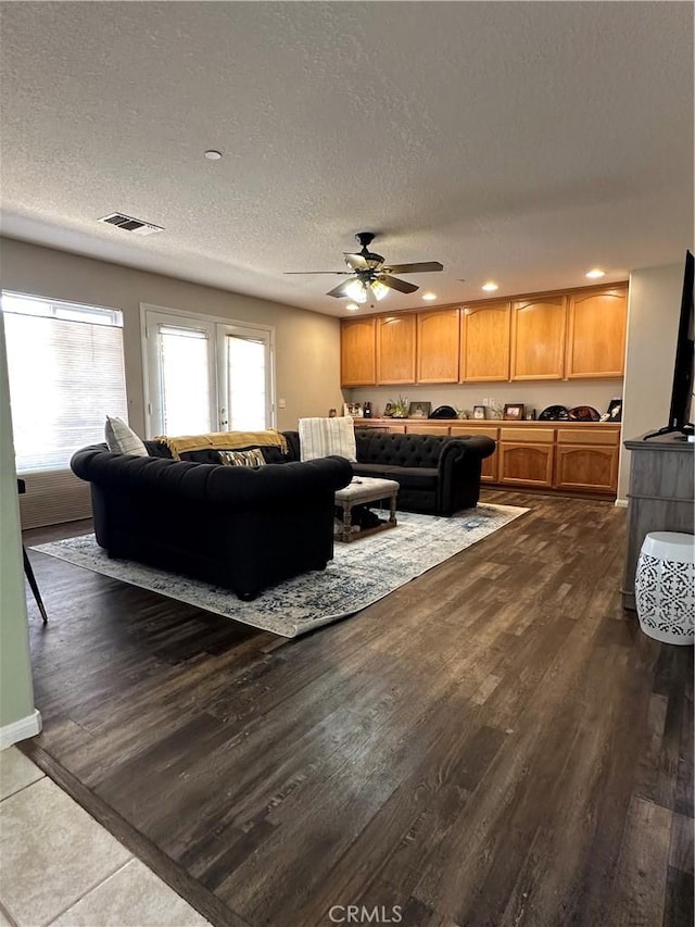 8843 San Diego Dr, Yucca Valley, CA 92284 - living room featuring a ceiling fan, a textured ceiling, dark wood-type flooring, and recessed lighting