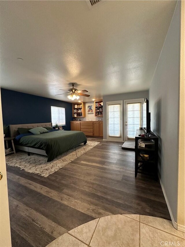 8843 San Diego Dr, Yucca Valley, CA 92284 - bedroom featuring wood finished floors, a ceiling fan, baseboards, and a textured ceiling