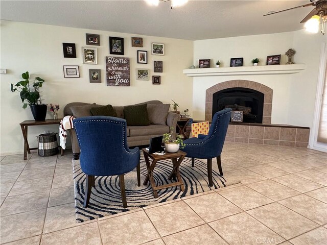 8843 San Diego Dr, Yucca Valley, CA 92284 - tiled living area with a ceiling fan and a fireplace