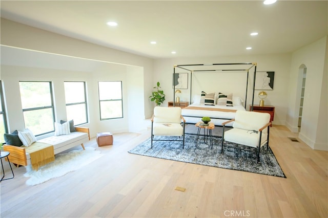 2480 Ardsheal Dr, La Habra Heights, CA 90631 - living area with arched walkways, light wood-type flooring, recessed lighting, and baseboards