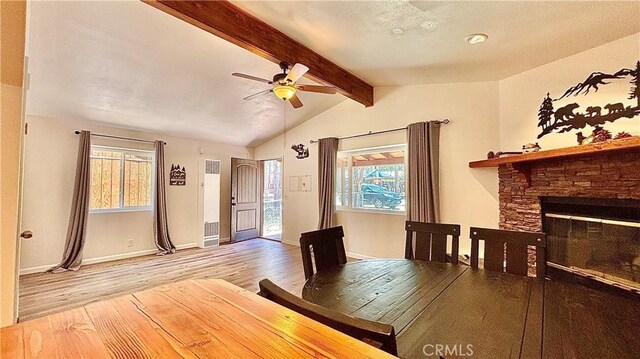 2051 6th Ln, Big Bear, CA 92314 - unfurnished dining area with wood finished floors, a ceiling fan, plenty of natural light, and a fireplace