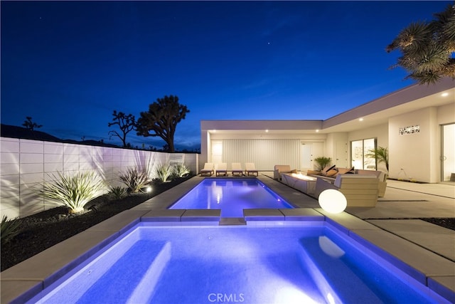 7035 Sunny Vista Rd, Joshua Tree, CA 92252 - pool at twilight featuring an outdoor living space with a fire pit, a patio area, a fenced backyard, and a pool with connected hot tub