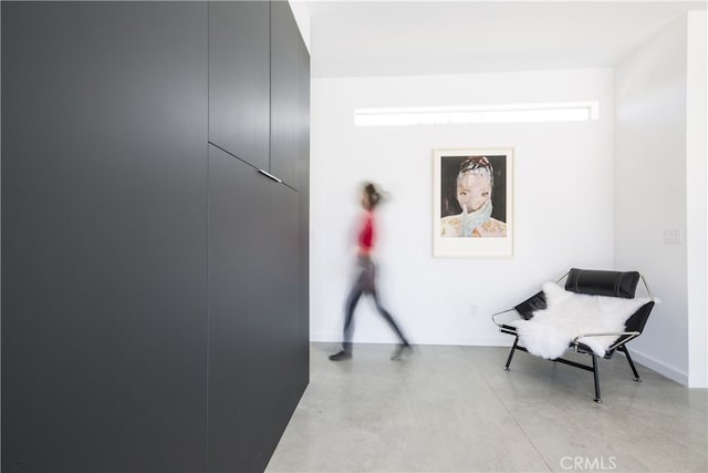 7035 Sunny Vista Rd, Joshua Tree, CA 92252 - hall with finished concrete flooring and baseboards