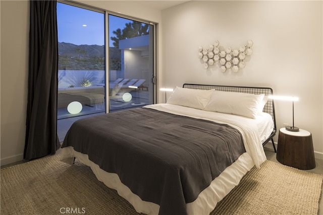 7035 Sunny Vista Rd, Joshua Tree, CA 92252 - bedroom with carpet floors, access to outside, baseboards, and a mountain view