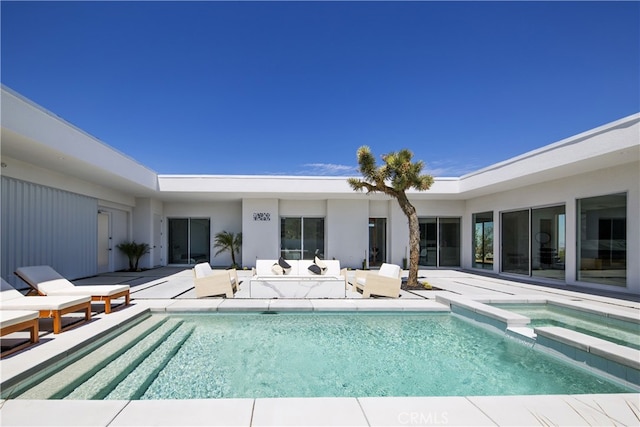 7035 Sunny Vista Rd, Joshua Tree, CA 92252 - view of swimming pool featuring a patio, a pool with connected hot tub, and an outdoor living space
