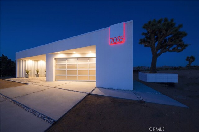 7035 Sunny Vista Rd, Joshua Tree, CA 92252 - garage at night with driveway