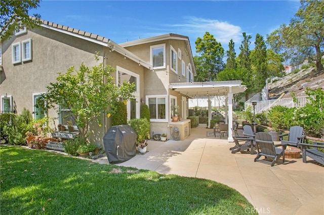 16 Vitale Ln, Lake Forest, CA 92610 - rear view of house with stucco siding and a patio
