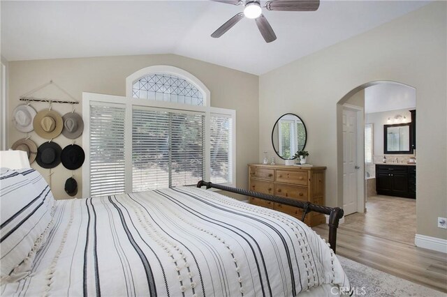 16 Vitale Ln, Lake Forest, CA 92610 - bedroom with lofted ceiling, light wood-style flooring, arched walkways, ceiling fan, and ensuite bathroom