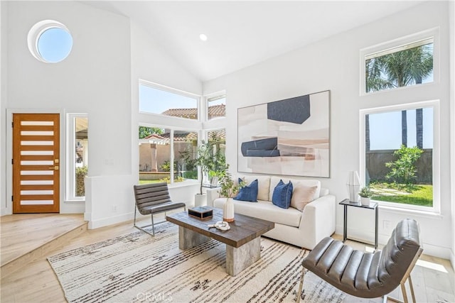 23 Santa Isabel, Rancho Santa Margarita, CA 92688 - living area with high vaulted ceiling, wood finished floors, baseboards, and recessed lighting