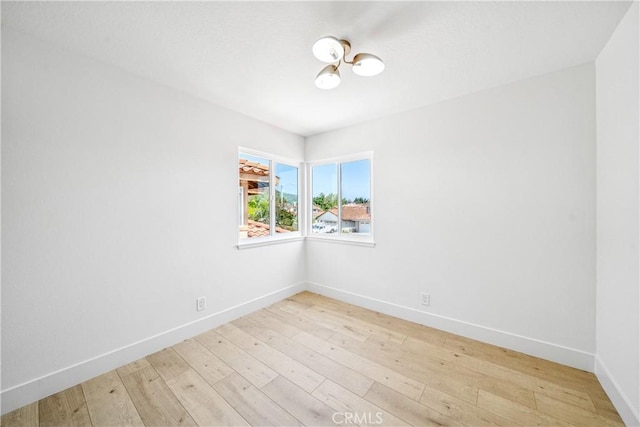 23 Santa Isabel, Rancho Santa Margarita, CA 92688 - unfurnished room featuring baseboards and light wood-style flooring