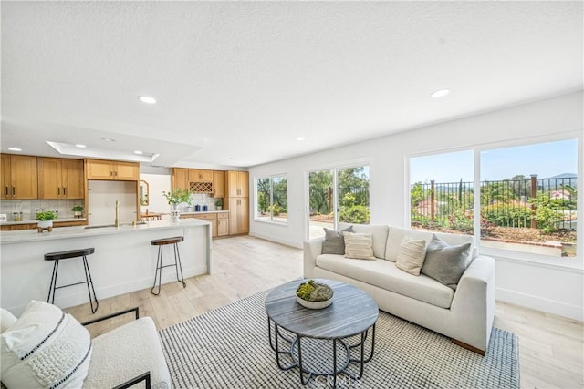 23 Santa Isabel, Rancho Santa Margarita, CA 92688 - living room with recessed lighting, light wood finished floors, and baseboards