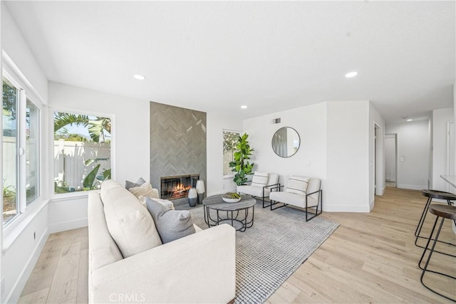 23 Santa Isabel, Rancho Santa Margarita, CA 92688 - living room with light wood-style flooring, a fireplace, baseboards, and recessed lighting