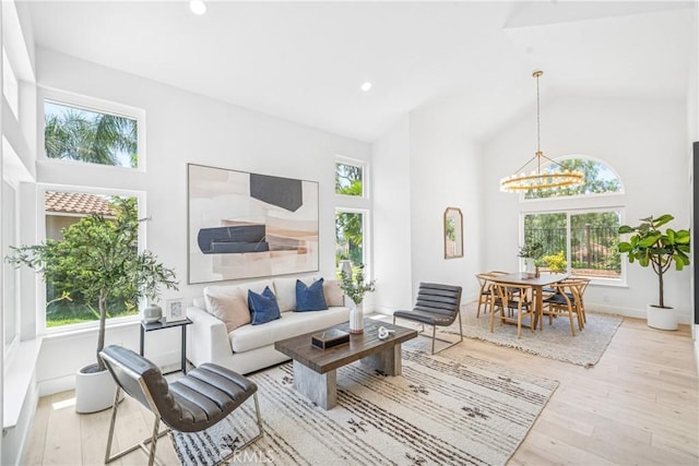 23 Santa Isabel, Rancho Santa Margarita, CA 92688 - living area featuring high vaulted ceiling, a chandelier, wood finished floors, recessed lighting, and baseboards