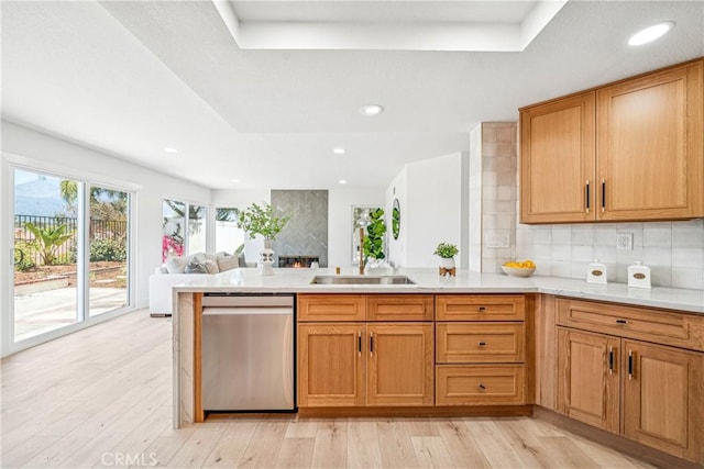 23 Santa Isabel, Rancho Santa Margarita, CA 92688 - kitchen featuring stainless steel dishwasher, a peninsula, open floor plan, tasteful backsplash, and a raised ceiling