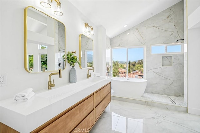 23 Santa Isabel, Rancho Santa Margarita, CA 92688 - full bathroom featuring healthy amount of natural light, vaulted ceiling, double vanity, marble tiled flooring, and a freestanding tub