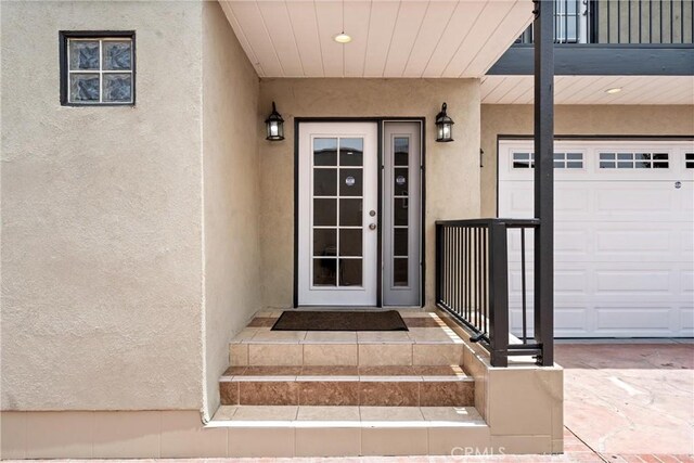 1960 Chariton St, Los Angeles, CA 90034 - entrance to property with stucco siding, a balcony, and a garage