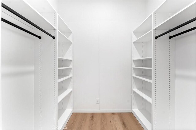 1960 Chariton St, Los Angeles, CA 90034 - spacious closet with light wood-style flooring